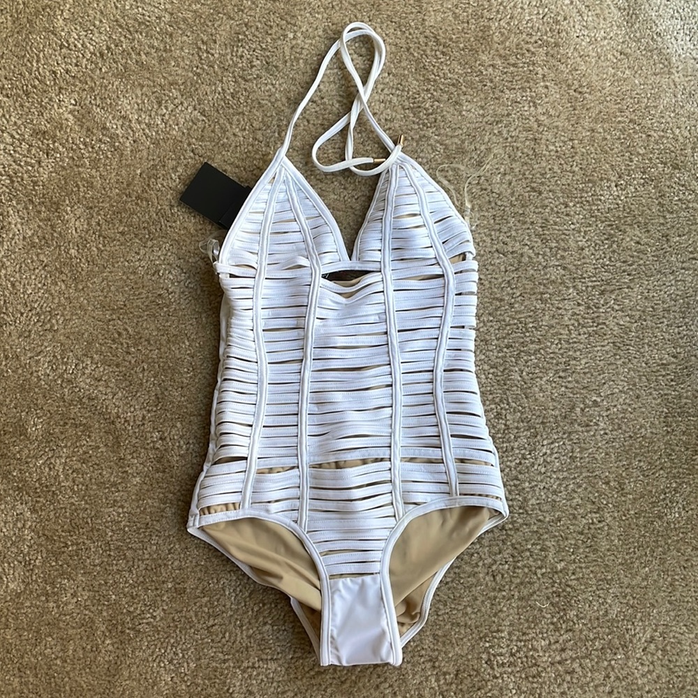 White NWT one piece sexy swimsuit with cut outs and a scrunch butt